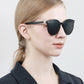Woman wearing black Veithdia Women's Round-Frame sunglasses