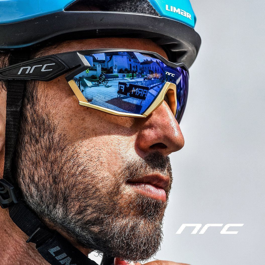 Close-up of a cyclist wearing NRC Pro Cycling glasses